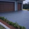 Concrete driveway with buxus hedge landscaping